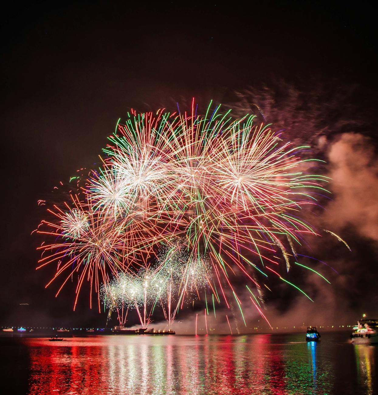 Fireworks reflecting off the calm water.
This image gives an idea of what you might expect to see and experience on our Friday night Sunset Cruise off the South Shore of Oahu near Diamond Head Crater. 